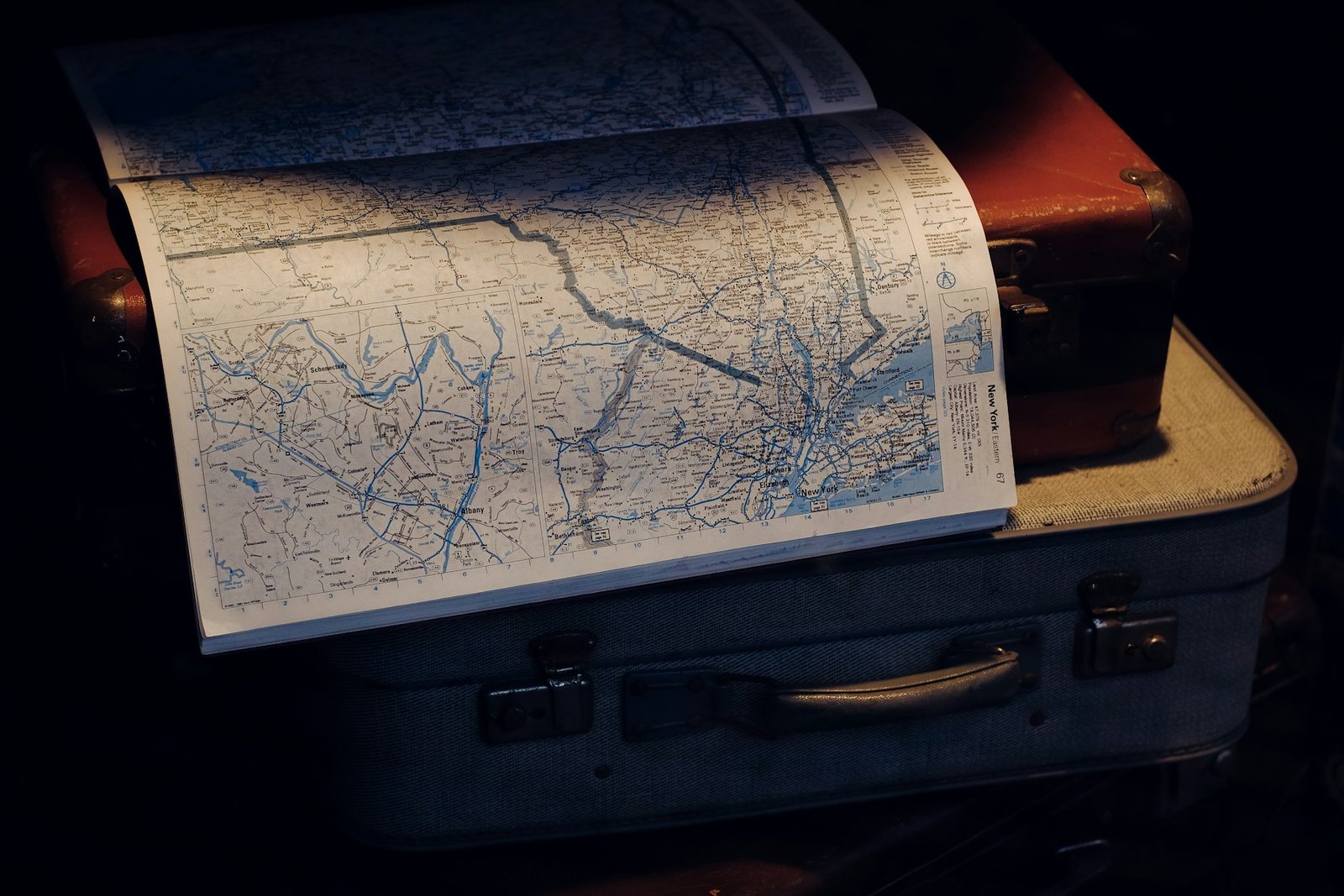 Travel suitcases with an open map