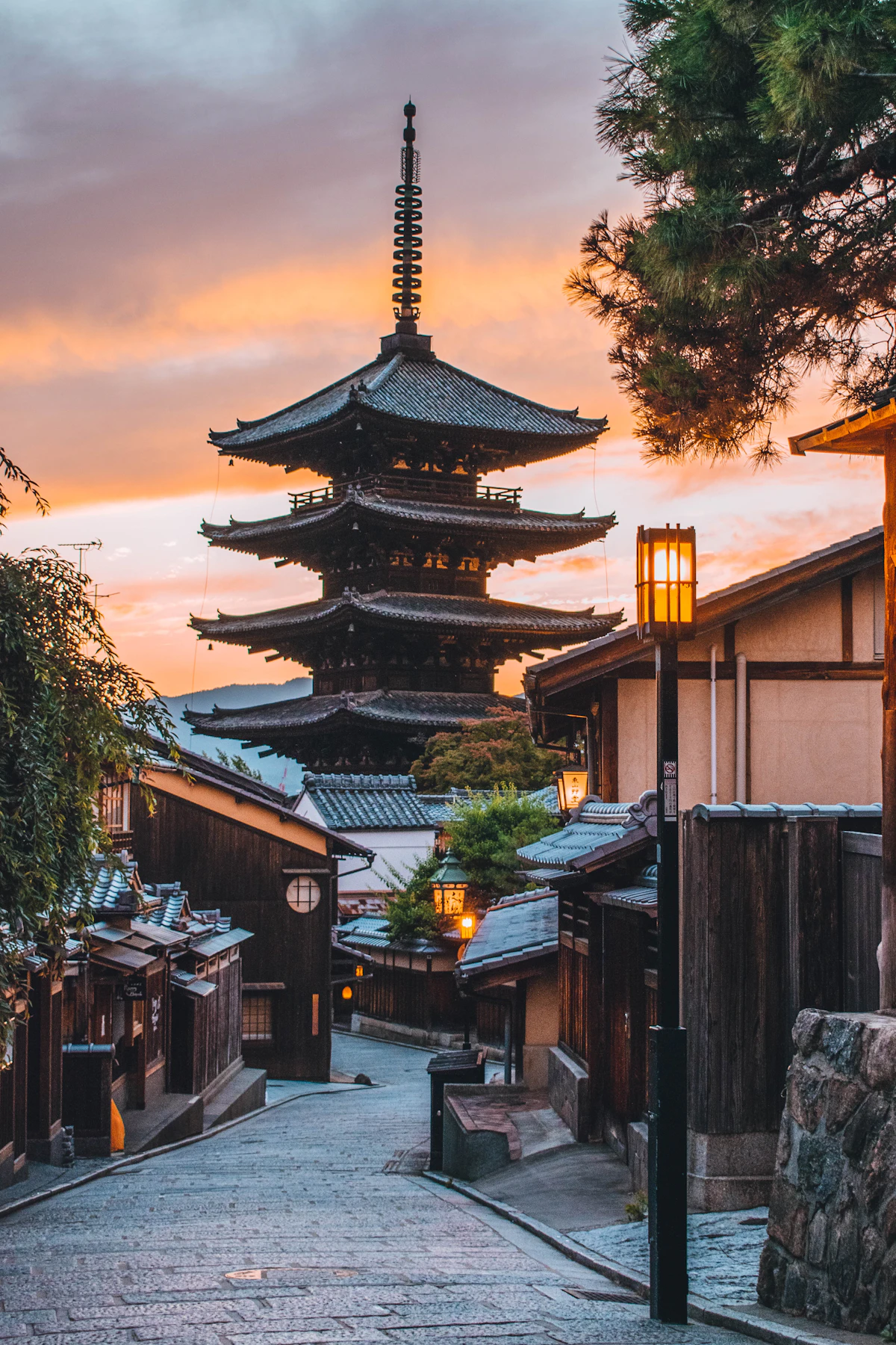 Traditional Kyoto street and pagoda glowing at golden hour